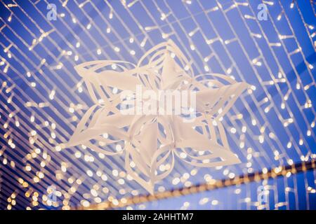 star paper cut hang in the LED light bulb camber Stock Photo