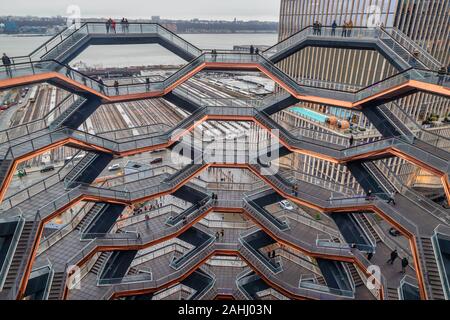 Vessel (Hudson yards redevelopment project ) in NYC at sunset with clouds in sky Stock Photo