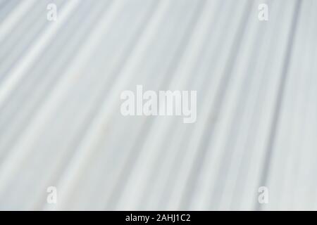blur white and clean metalic roof pattern in day time Stock Photo