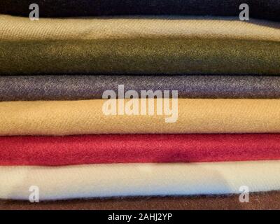 Piled turkish multi colored cashmere fabric pieces. Stock Photo