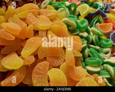 Jelly fruits and traditional turkish delight sweets at market counter. Stock Photo