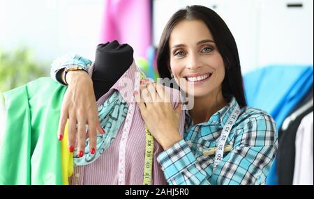 Smiling creative fabric worker Stock Photo