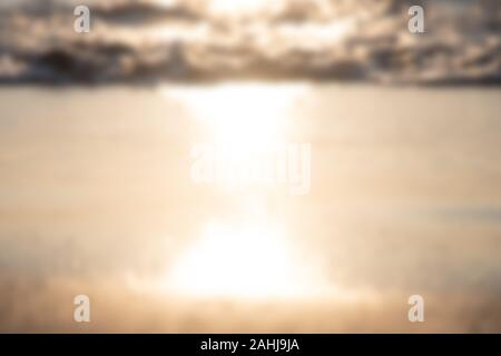 Blurred sand texture surface on the beach, sunset light reflection make golden Stock Photo