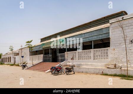 Sukkur Main Railway Station Picturesque View of the Reservation Office Entrance with Parked Motorbikes on a Sunny Blue Sky Day Stock Photo