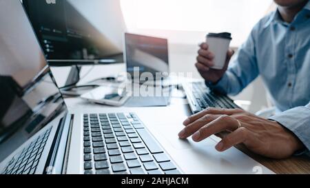 Programmer Typing Code on desktop computer, Developing programming and coding technologies concept Stock Photo