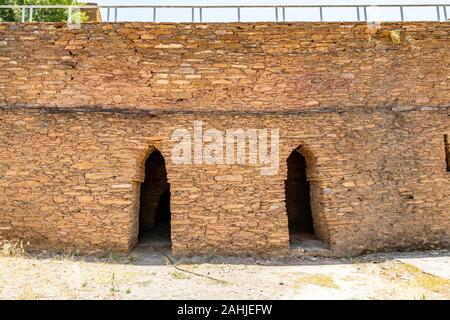 Mardan Takht-i-Bahi Throne of the Water Spring View of Underground Monk Cells on a Sunny Blue Sky Day Stock Photo