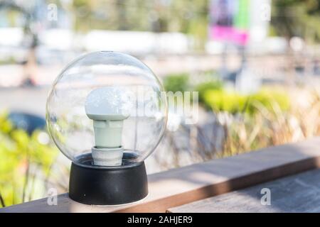 light bulb circular perfect on balcony in the morning, but it still turn off Stock Photo