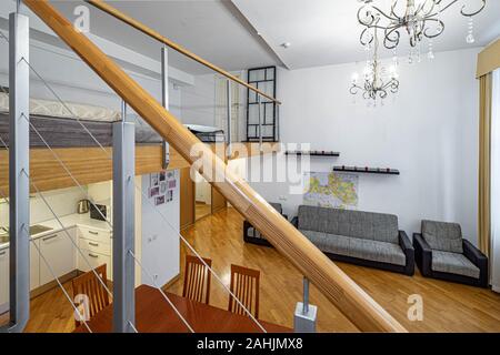 View of living room from staircase to the second floor. Private house. Modern interior. Stock Photo