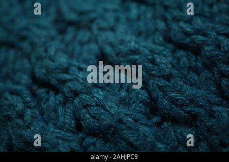 Knitted texture, dark blue thread pattern, cozy winter background. Stock Photo