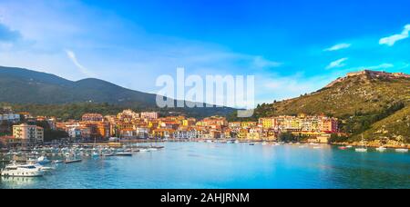 Porto Ercole village and boats in harbor in a sea bay. Aerial view. Monte Argentario, Maremma Grosseto Tuscany, Italy Stock Photo