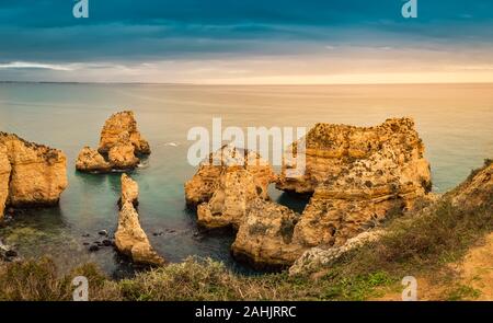 Ponta da Piedade cliffs at sunset near Lagos, Portugal. Beautiful seascape with natural rock formations. Most famous attraction in the Algarve, portug Stock Photo