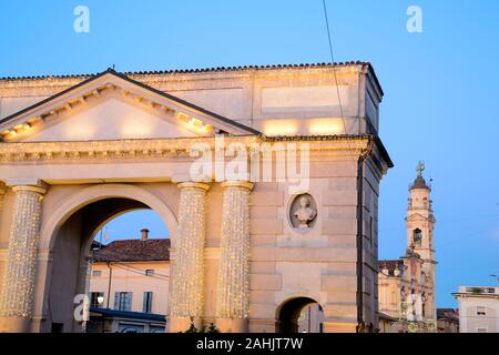 Italy, Lombardy, Crema, Porta Ombriano Gate background Church of the Santissima Trinita, Christmas Lights Stock Photo