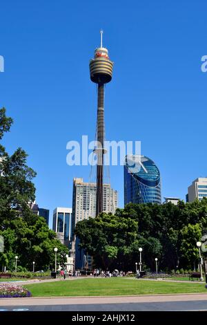 Sydney, NSW, Australia - October 29, 2017: Unidentified people in Hyde park with Archibald fountain, Sydney tower and skyscraper behind Stock Photo