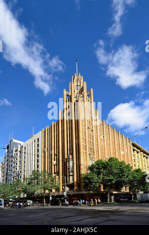 Melbourne, VIC, Australia - November 03, 2017: Unidentified people and historic Manchester Unity Building, an Art Deco inspired office building Stock Photo