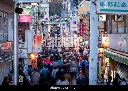 March 3, 2019: Crowds walk through Takeshita Street in the Harajuku district. Tokyo, Japan. Stock Photo