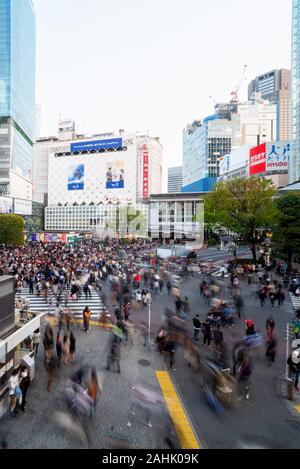 March 7, 2019: People walk across the streets in the busy Shinjuku district. Tokyo, Japan Stock Photo