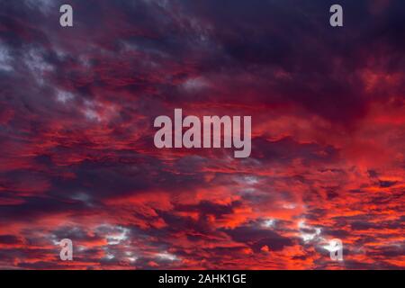 Dramatic red clouds - beautiful colorful sunset Stock Photo