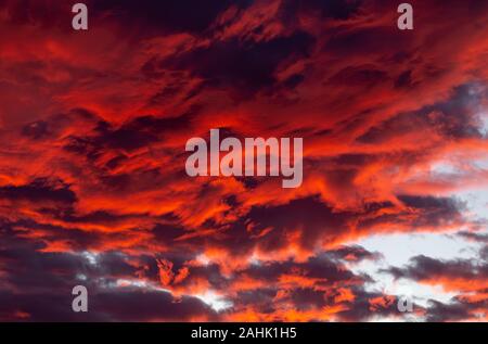 Dramatic red clouds - beautiful colorful sunset Stock Photo