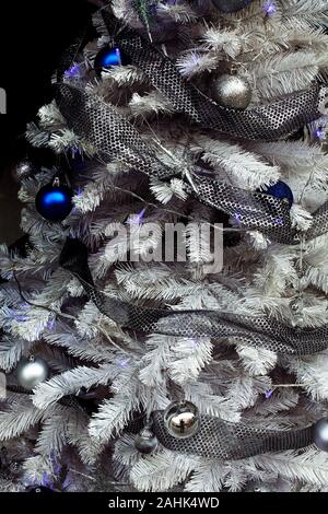 Fake Christmas tree in shop window, Barcelona. Stock Photo