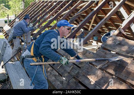 Carpenters working on an old house in Ashfield, Massachusetts Stock Photo