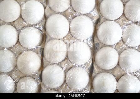 White chicken eggs in a paper tray Stock Photo