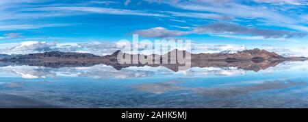 Panorama of mountain reflections on the salt flats in Utah Stock Photo