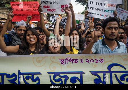 Kolkata, West Bengal, India. 19th Dec, 2019. Caption: Kolkata, West Bengal, India, December 30, 2019: Protest against controversial Citizenship Amendment Act continues acorss the country where a massive number of people especially students and common man including muslim community .has raised their voice againstthe bill passed by Goverment of India at parliament house. Kolkata, the capital of West Bengal among those cities of India where students, common man irrespective of religious community, political identity has formed .massive protest against Citizenship Amendment bill as it invokes Stock Photo