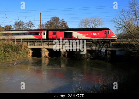 LNER train 43314, over a flooded river, East Coast Main Line Railway, Grantham, Lincolnshire, England, UK Stock Photo