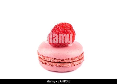 Pink macaroon with raspberry isolated on a white background. Sweet macaroons. French dessert - macaroons. Stock Photo