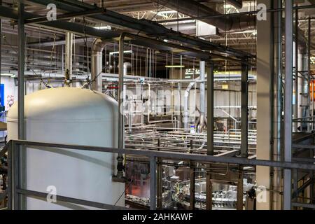 beer factory interior view, metal pipes, brewing industry piping system and tanks, packaging and bottling area, brewhouse brewery industrial machines Stock Photo