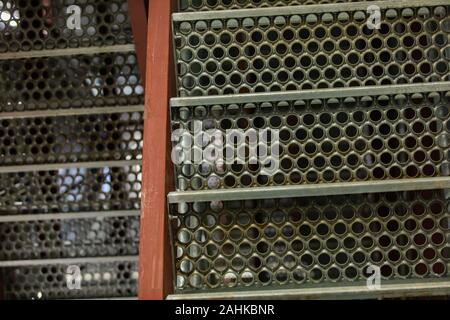 metal grid stairs close up low angle view, selective focus Steel Industrial Catwalks with blurred background, copy space Stock Photo