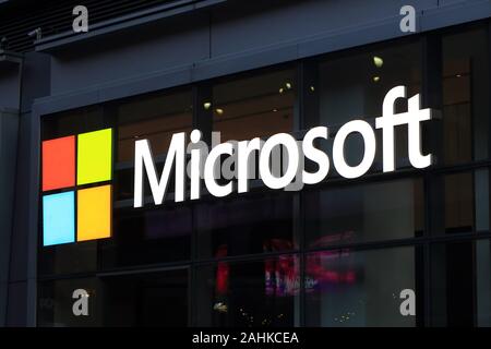 The Microsoft logo on a building with glass and black metal construction in the Times Square neighborhood of Manhattan, New York, NY Stock Photo