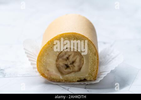 Swiss Banana Roll Cake Sponge / Rolled or Roulade Cake Ready to Eat. Traditional Dessert. Stock Photo