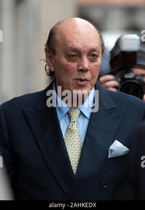 Former Polly Peck chief exec Asil Nadir and his wife Nur at the Old Bailey in London where the judge ruled that he will have to face charges of fraud. Stock Photo