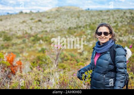 Young woman exploring the nature of a beautiful paramo at the department of Cundinamarca in Colombia Stock Photo