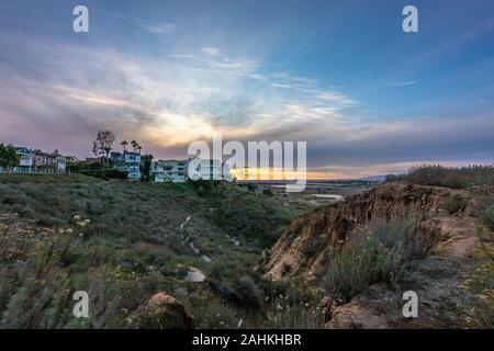 Long exposure bluff top view of Ballona Wetlands at sunset with colorful sky and Santa Monica Mountains in the distance, Playa Del Rey, California
