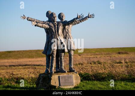 A statue of The Short Brothers, Oswald, Horace, and Eustace at Leysdown, Isle of Sheppy. The brothers built the first production aircraft in the UK. Stock Photo