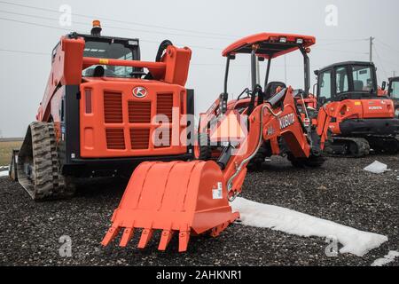 Brand new diggers waiting to be sold. Stock Photo