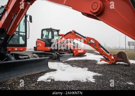 Brand new diggers waiting to be sold. Stock Photo