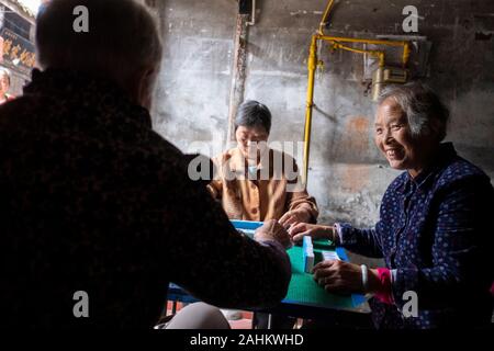 Women play mahjong in the Pingle Ancient Town, China Stock Photo
