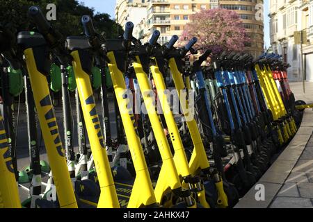 Mulitple electric scooters in Malaga, Spain Stock Photo
