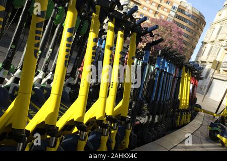 Mulitple electric scooters in Malaga, Spain Stock Photo