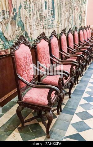 Tarragona Spain Hispanic Catalonia Metropolitan Cathedral Basilica,Catedral Basilica,Catholic church,inside,Chapter Room,chairs,red brocade,Baroque st Stock Photo