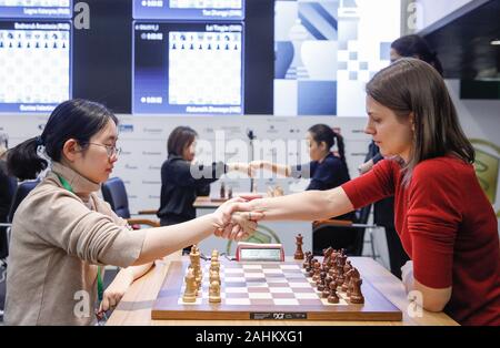 Moscow, Russia. 30th Dec, 2019. Wang Hao (L) of China and Alireza Firouzja  participating under the FIDE flag shake hands after the Blitz Open final at  2019 King Salman World Rapid 