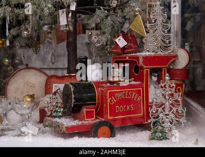 Old wooden toy train in a christmas window display. Broadway, Cotswolds, Worcestershire, England Stock Photo