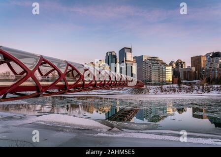 View of Calgary's skyline on a cold winter day. Bow River and the Peace Bridge are visible in the image.  Office towers in the downtown core are also. Stock Photo