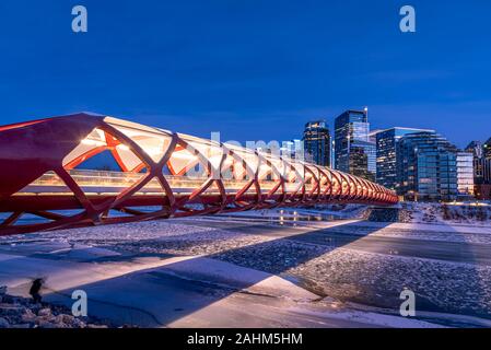 View of Calgary's skyline on a cold winter day. Bow River and the Peace Bridge are visible in the image.  Office towers in the downtown core are also. Stock Photo