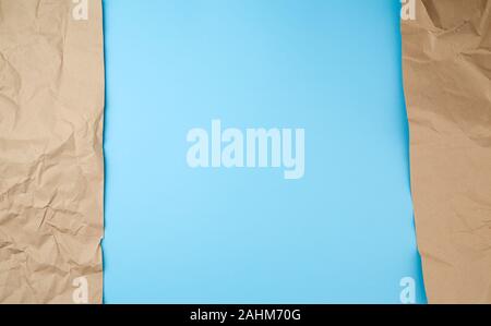 Retro brown paper torn, great design for any purposes. Abstract texture. Blue banner, copy space. Stock Photo