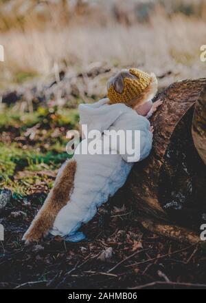 Little boy dressed as Max from Where The Wild Things Are in the woods