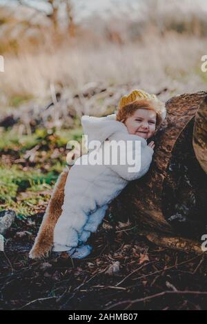 Little boy dressed as Max from Where The Wild Things Are in the woods